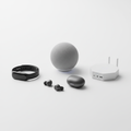 Collection of premium electronics and gadgets including wireless earbuds, smart speaker, fitness tracker, and home automation hub